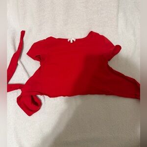 Comfy red crop top with open tie back 
Never worn 
Size S, would fit XS